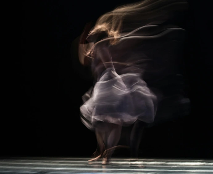 dancing woman on concrete pavement